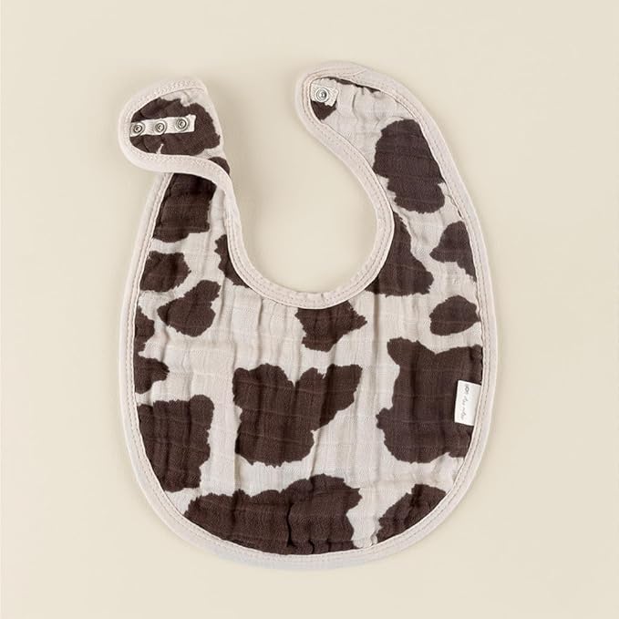 Itzy Ritzy Set of 3 Baby Bibs - Ultra-Soft Adjustable Infant & Toddler Bibs Made of Triple-Layer Cotton Muslin, Ideal for Drooling, Teething, & Eating - 3 Stylish, Coordinating Prints (Cow Print)