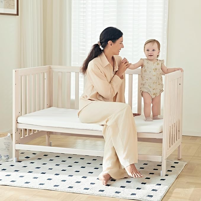 EvoNest Baby Crib, 6 in 1 Convertible Mini Crib with Wheels, 100% New Zealand Solid Wood Growing Bed, 4 Adjustable Mattress Height，Washed Natural