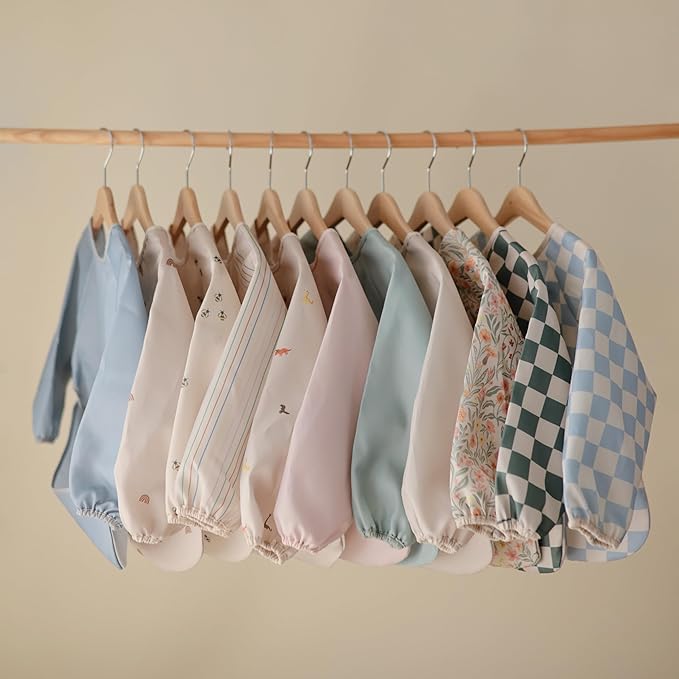 mushie Long Sleeve Baby Bib | Water Resistant Adjustable Fit for Ages 6-24 Months