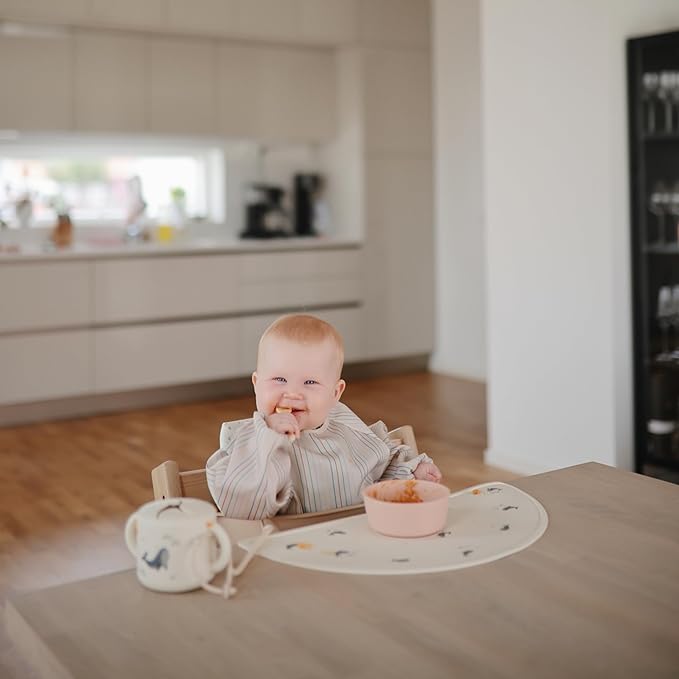 mushie Long Sleeve Baby Bib | Water Resistant Adjustable Fit for Ages 6-24 Months