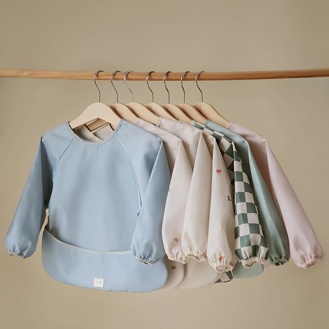 mushie Long Sleeve Baby Bib | Water Resistant Adjustable Fit for Ages 6-24 Months