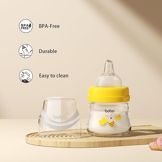YOHKOH Glass Baby Bottles with Slow Flow Nipple, Newborn Anti-Colic Baby Bottles for 0+ Months, Wide Neck Feeding Bottle, Clear (Yellow, 2.7oz (Pack of 2))