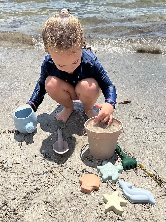 Silicone Beach Toys - Beach Bucket Set with Shovel, 4 Sand Molds - Travel-Friendly Kids Sand Toys in Net Carrying Bag - Safe Baby Sand Toys - Dishwasher-Safe (Blush Pink)